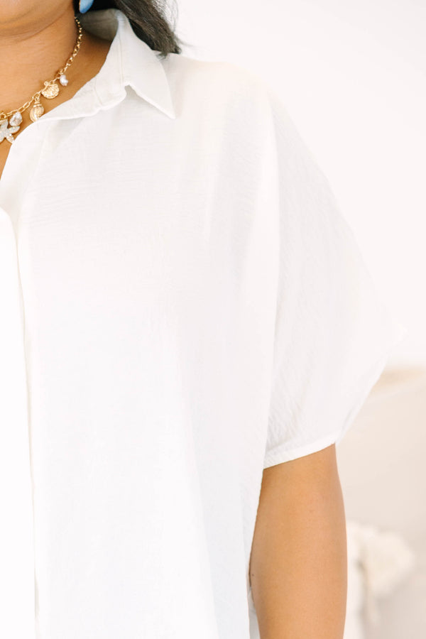 Plus size flowy short-sleeve button-down top with a relaxed fit.