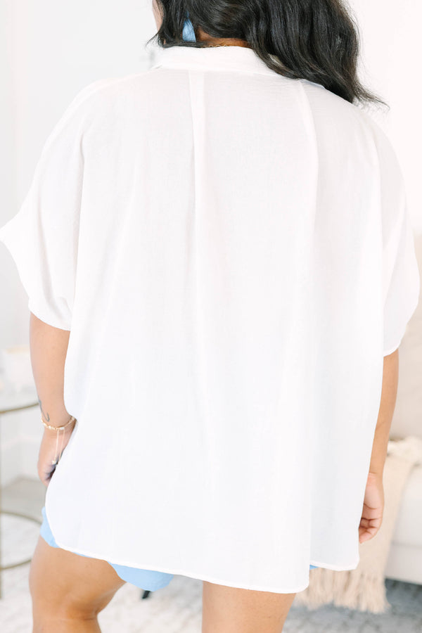 Plus size flowy short-sleeve button-down top with a relaxed fit.