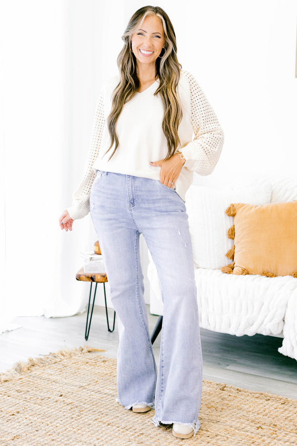 Chic Soul plus size clothing, light wash high rise flare jeans with distressed hem