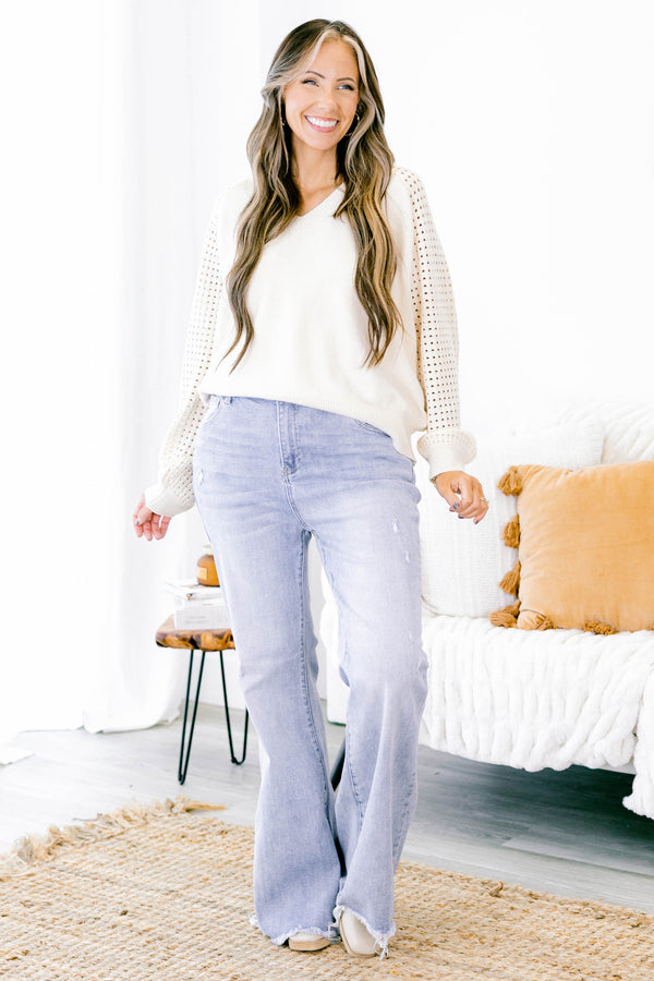 Chic Soul plus size clothing, light wash high rise flare jeans with distressed hem