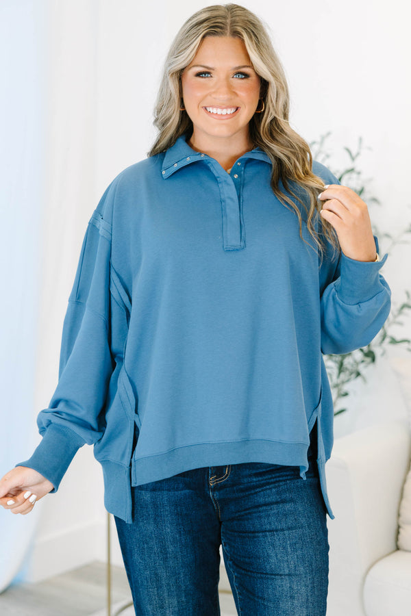 Plus Size blue long-sleeve pullover with a collared snap-button neckline and ribbed trim.