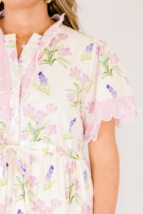 Chic Soul plus size clothing, cream short sleeve dress with pink and green floral pattern inside dress and pink scallop trim on the sleeves and pink scallop trim on tiers of skirt