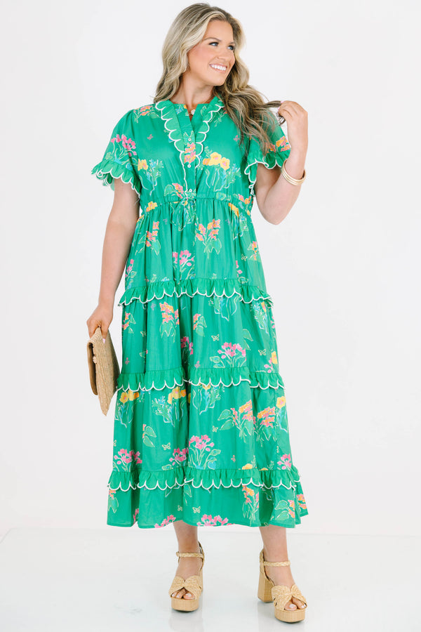 Plus Size green tiered midi dress with floral print, scalloped trim, and short flutter sleeves.