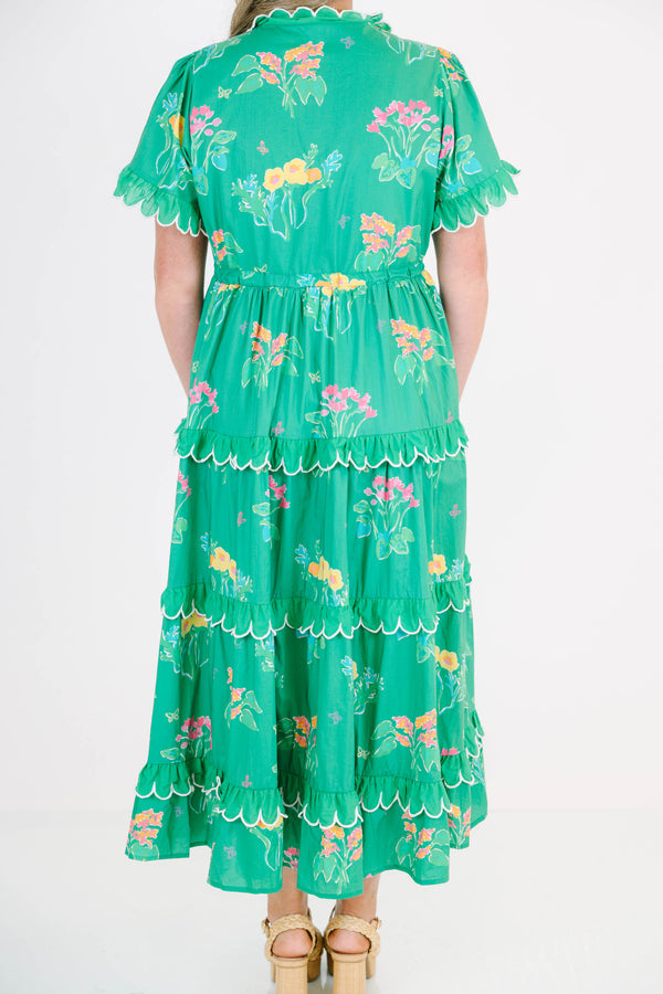Plus Size green tiered midi dress with floral print, scalloped trim, and short flutter sleeves.