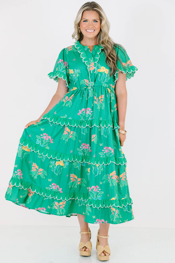 Plus Size green tiered midi dress with floral print, scalloped trim, and short flutter sleeves.