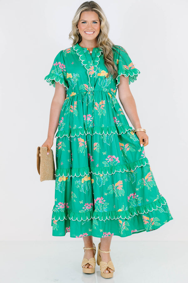 Plus Size green tiered midi dress with floral print, scalloped trim, and short flutter sleeves.