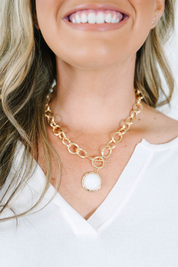 Plus Size gold chain link necklace with a white stone pendant and matching gold stud earrings.