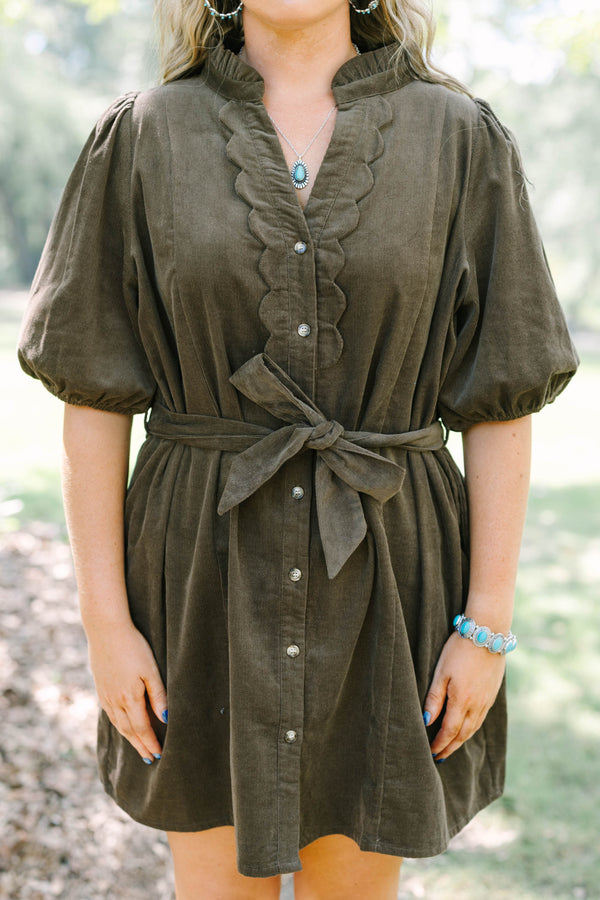 Plus Size brown corduroy mini dress with scalloped button front, puff sleeves, and a tie waist.