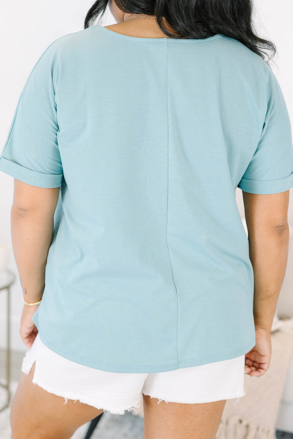 Plus size mint green short-sleeve top with a flowy fit 