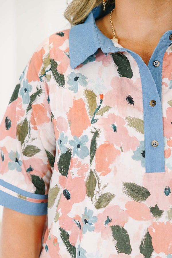 Plus size pink floral cotton dress with blue denim-style collar, button placket, and hem trim.