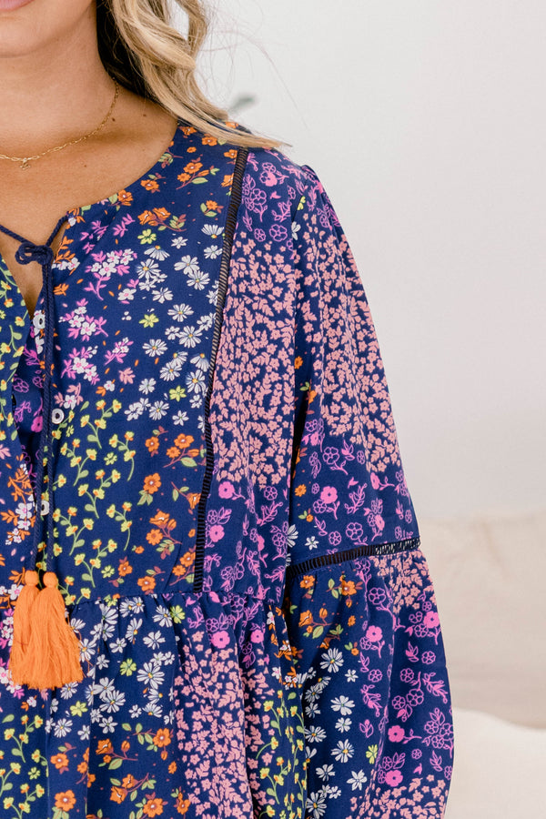 Chic Soul plus size clothing, navy floral long sleeve top with orange tassels hanging from the neckline 