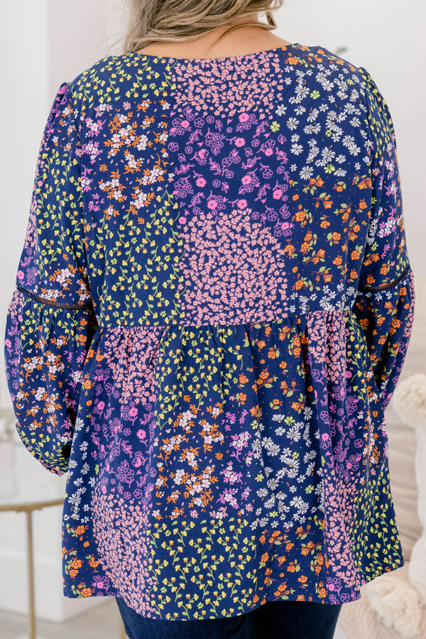 Chic Soul plus size clothing, navy floral long sleeve top with orange tassels hanging from the neckline 