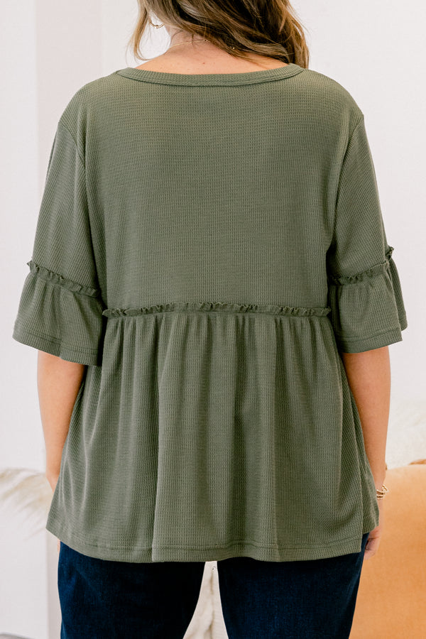 Chic Soul plus size clothing, Olive baby doll top that has short sleeves and small ruffling across the chest and on top of the sleeves 
