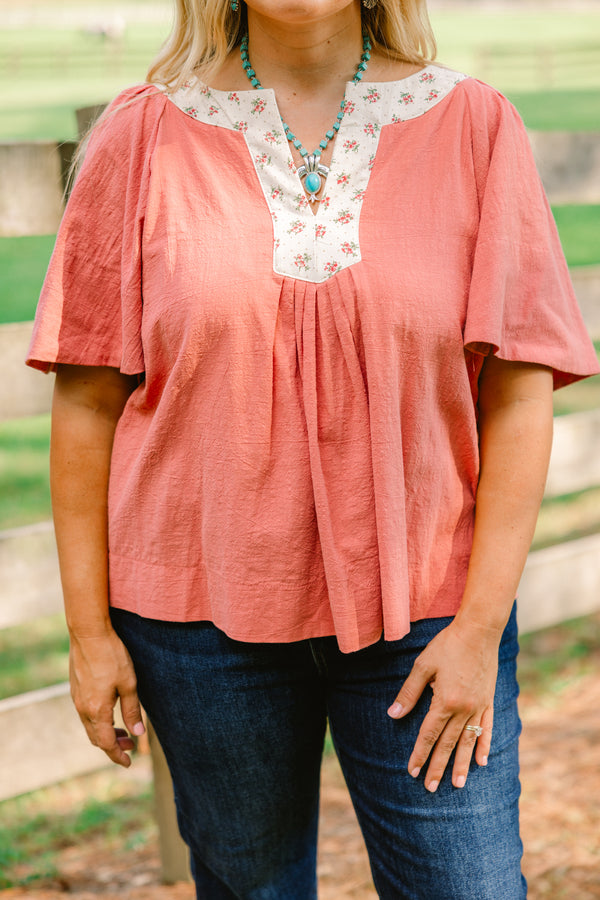 Chic Soul plus size clothing, rust red short bell sleeve top with v neckline and white floral print lining the neckline 
