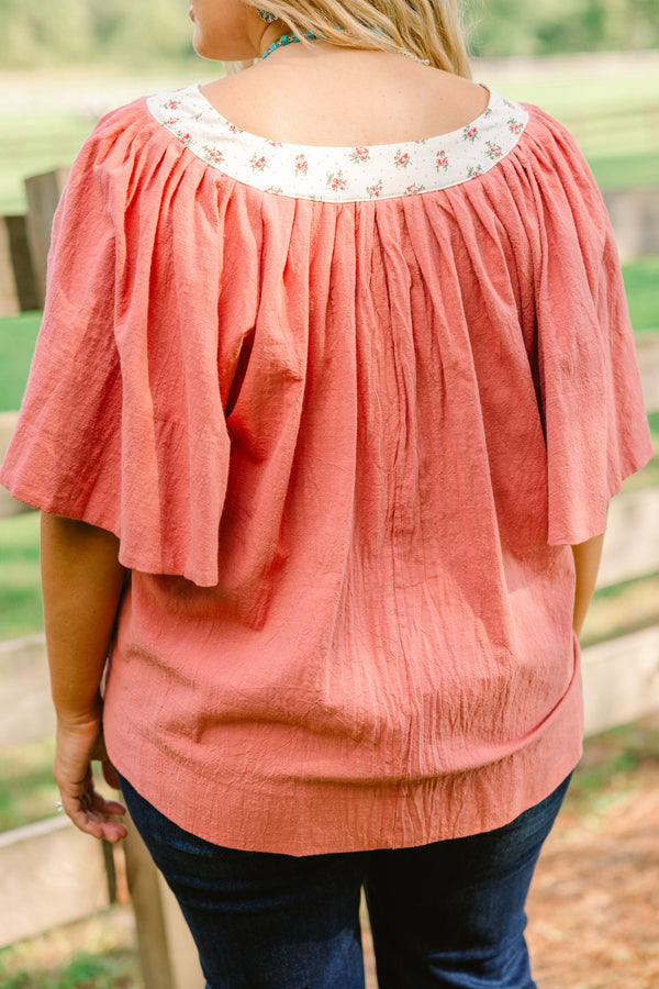 Chic Soul plus size clothing, rust red short bell sleeve top with v neckline and white floral print lining the neckline 