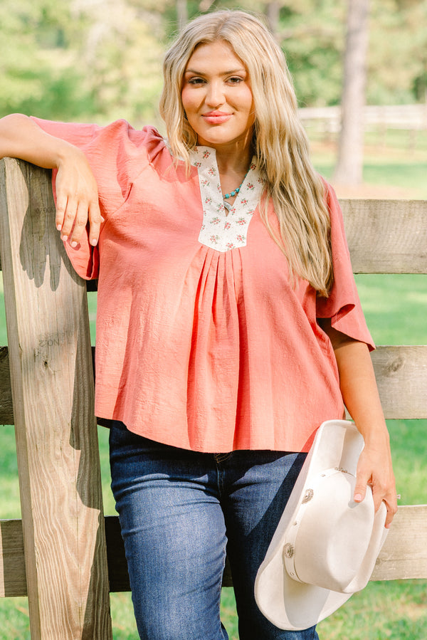 Chic Soul plus size clothing, rust red short bell sleeve top with v neckline and white floral print lining the neckline 