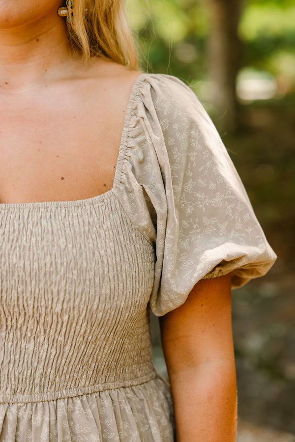 Chic Soul plus size clothing, tan tiered maxi dress with a square neckline and bubble sleeves as well as a subtle floral pattern 