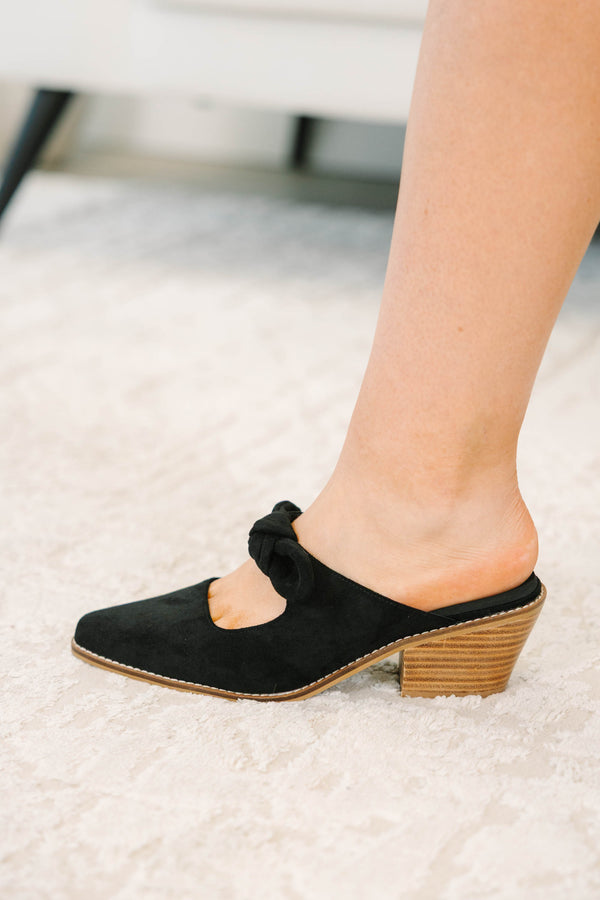Plus Size black suede pointed-toe mule heels with a knotted bow strap and wooden block heel.