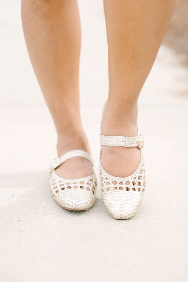 Chic Soul plus size clothing, gold woven close toed flats with a strap going across that top of the foot that had a buckle 