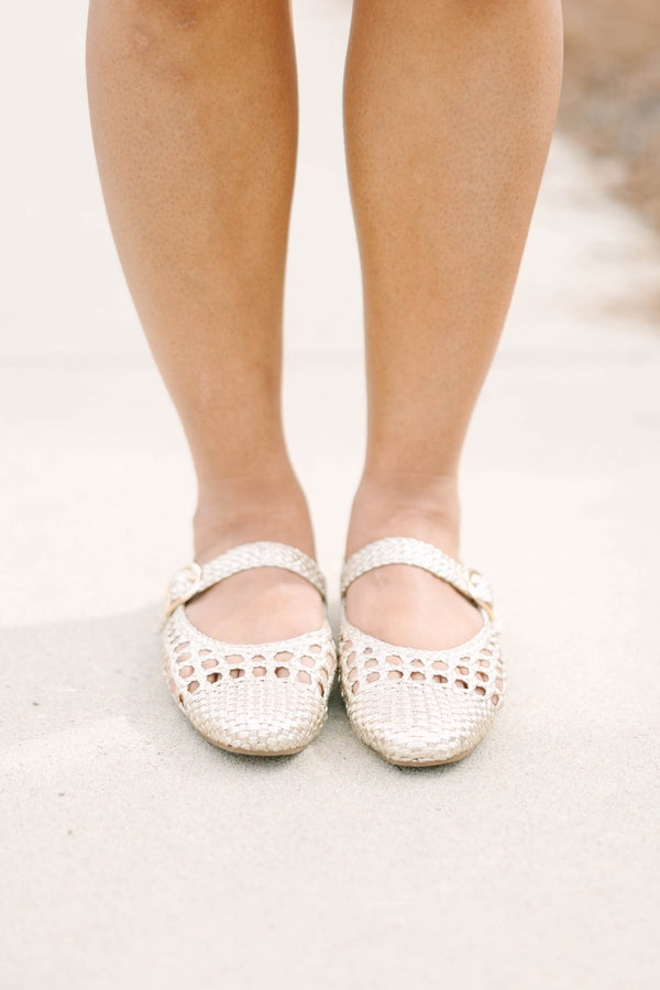 Chic Soul plus size clothing, gold woven close toed flats with a strap going across that top of the foot that had a buckle 