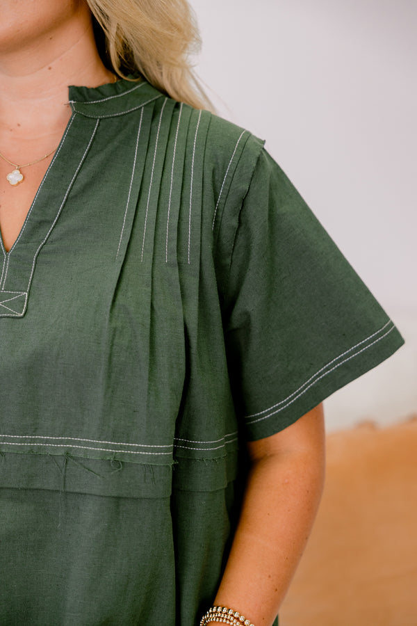 Chic Soul plus size clothing, forest green short sleeve v-nect top with small collar and cream color stitch detailing on the seams on the neckline, sleeves, and hem