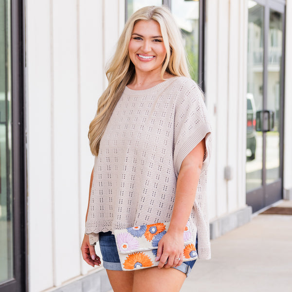 Plus Size latte-colored textured knit top with a relaxed fit, side split, and scalloped hem.