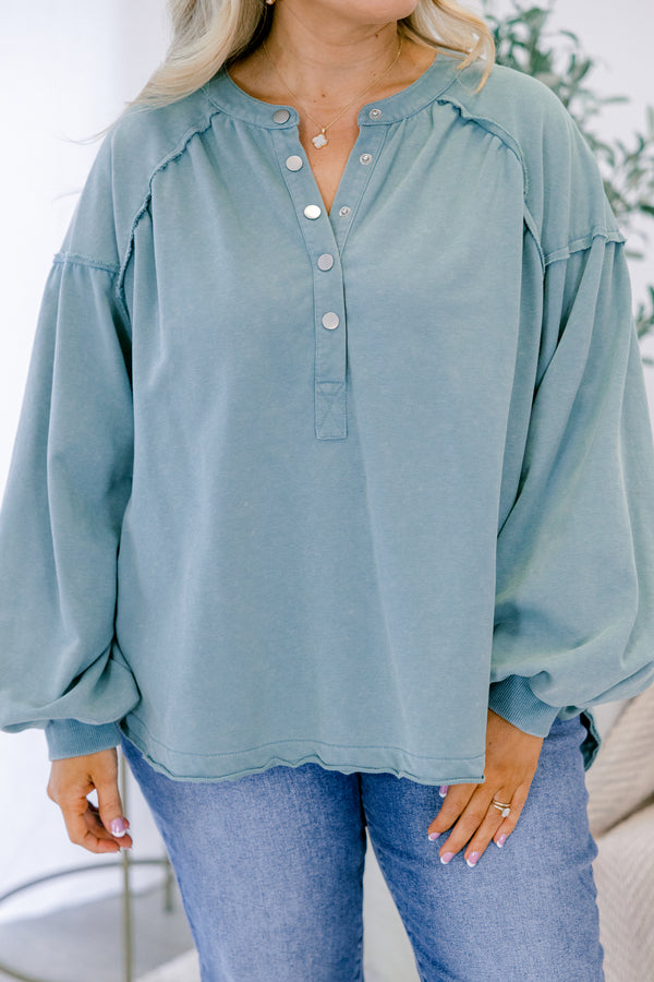 Chic Soul plus size clothing, dusty teal long sleeve top with silver snap buttons half way down the front and a scoop hem
