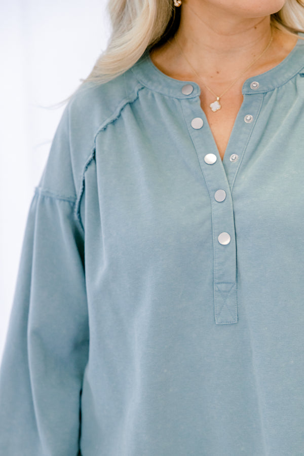 Chic Soul plus size clothing, dusty teal long sleeve top with silver snap buttons half way down the front and a scoop hem