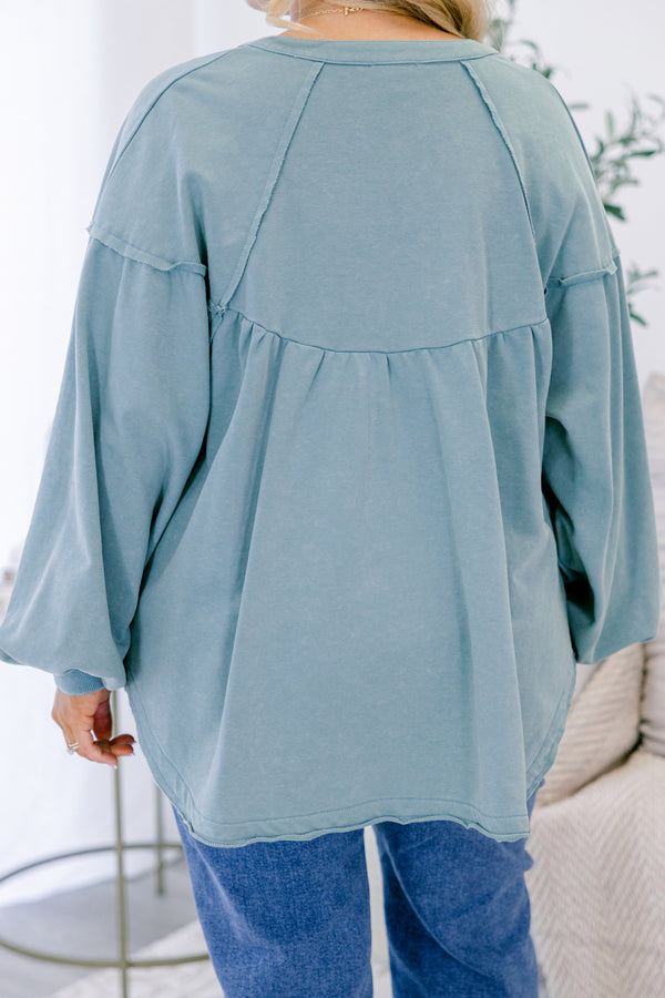 Chic Soul plus size clothing, dusty teal long sleeve top with silver snap buttons half way down the front and a scoop hem