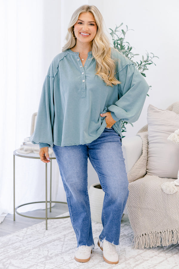 Chic Soul plus size clothing, dusty teal long sleeve top with silver snap buttons half way down the front and a scoop hem