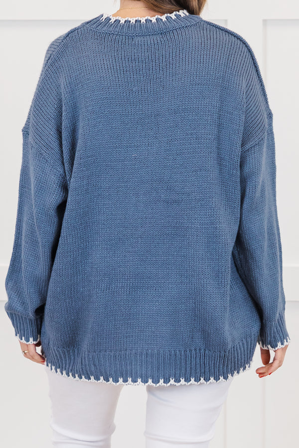 Chic Soul plus size clothing, blue long sleeve knit sweater with white bow knit design on the front with round neckline and cuff sleeves with white knit scalloped design along bottom, sleeves, and neckline