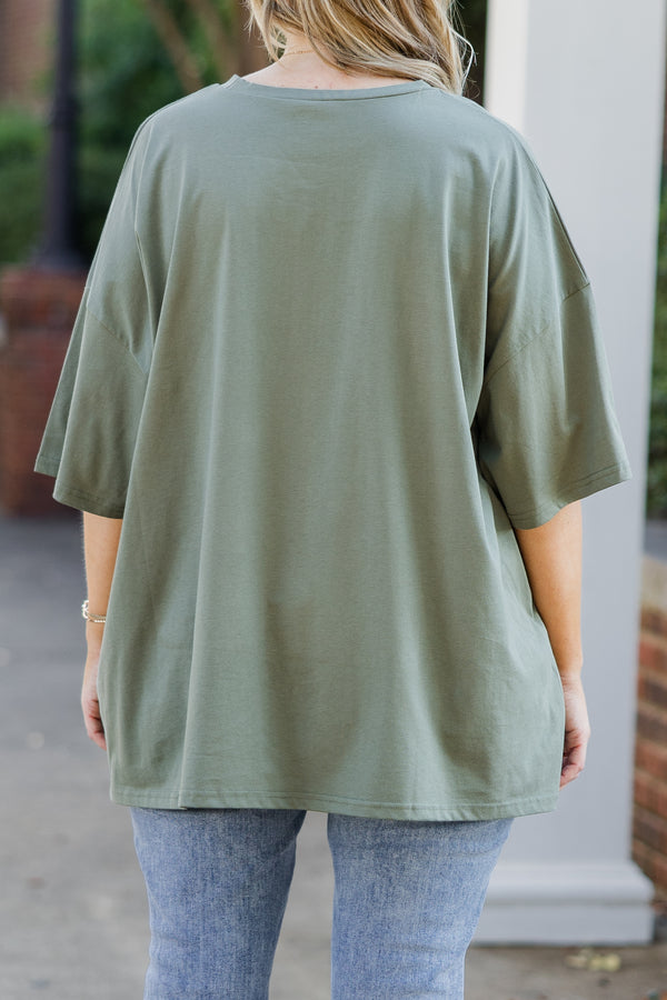 Chic Soul plus size clothing, short-sleeve moss green boyfriend tee with graphic art of pink bows and pink ghosts 