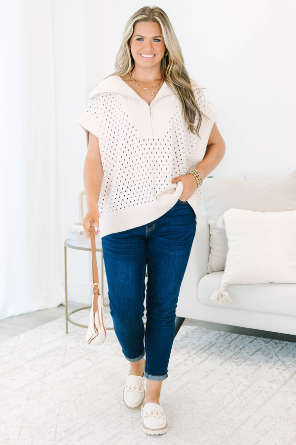 Plus Size taupe knit sweater with a quarter-zip collar, short sleeves, and open-stitch pattern.
