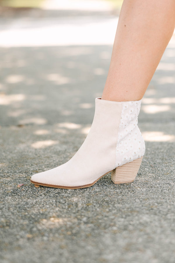 Plus Size beige pointed-toe booties with a block heel and floral daisy embroidery on the back.