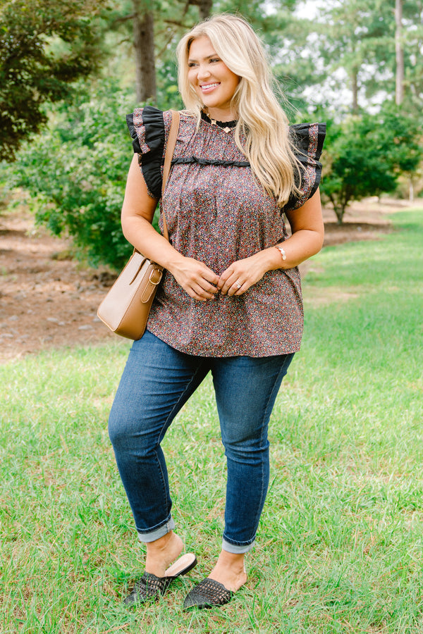 Chic Soul plus size clothing, black top with a small multi color floral pattern and flutter sleeves that have ruffle detailing 