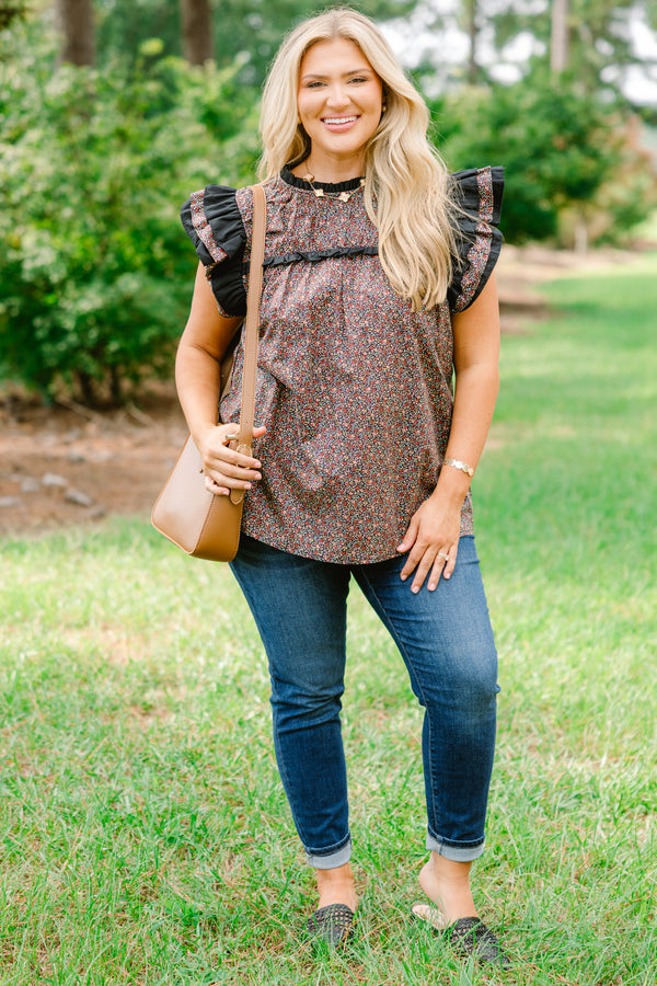 Chic Soul plus size clothing, black top with a small multi color floral pattern and flutter sleeves that have ruffle detailing 