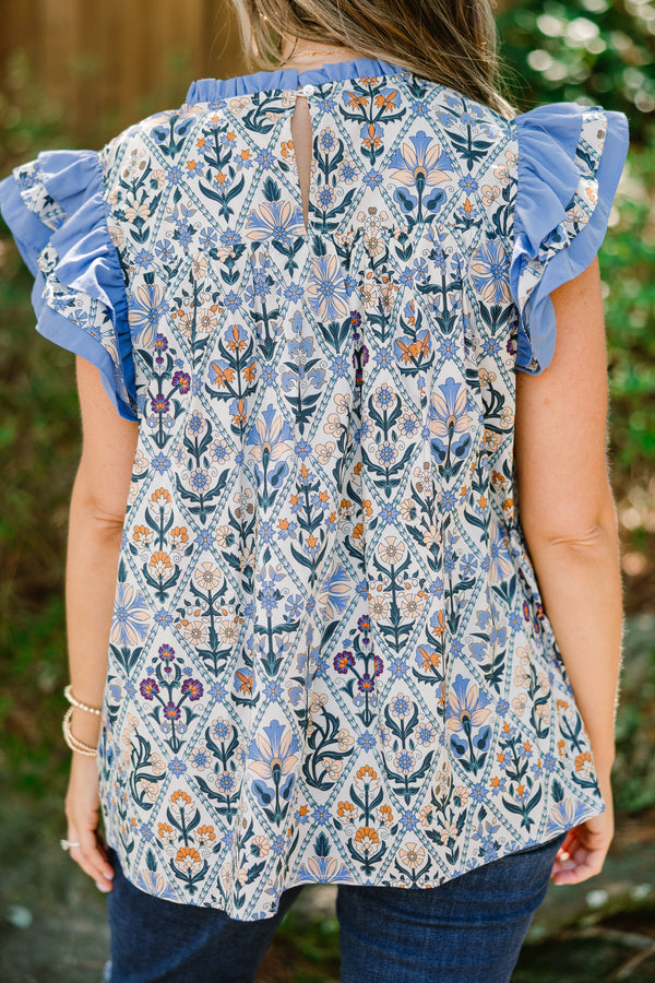 Chic Soul plus size clothing, blue floral print short flutter sleeve top with blue ruffles on sleeves and across top of chest
