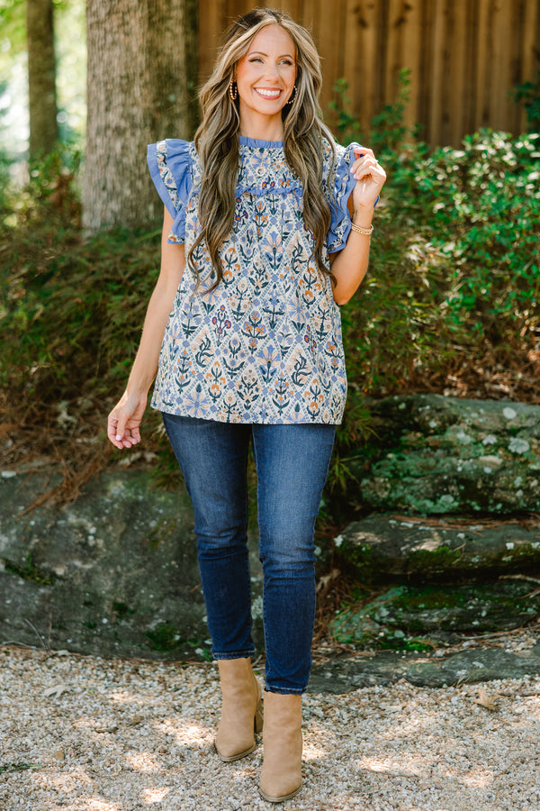 Chic Soul plus size clothing, blue floral print short flutter sleeve top with blue ruffles on sleeves and across top of chest
