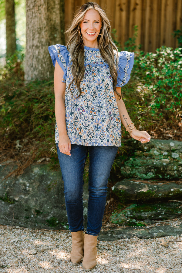 Chic Soul plus size clothing, blue floral print short flutter sleeve top with blue ruffles on sleeves and across top of chest
