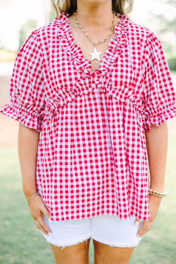 Plus size flowy short-sleeve button-down top with a relaxed fit.