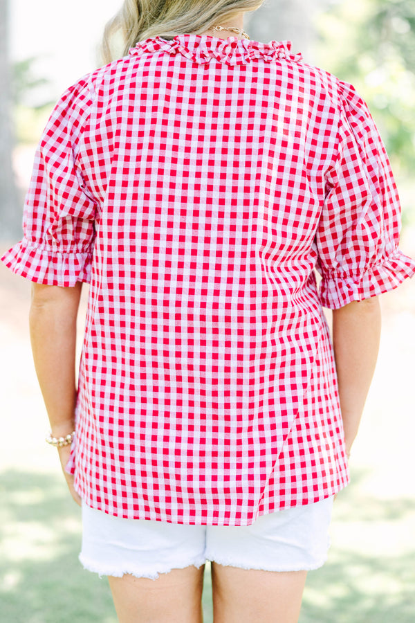 Plus size flowy short-sleeve button-down top with a relaxed fit.