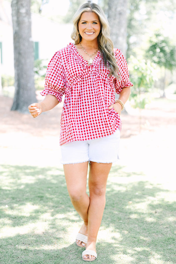Plus size flowy short-sleeve button-down top with a relaxed fit.