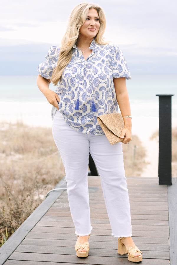 Chic Soul plus size clothing, blue and white patterned short puff sleeve top with button up ruffle collar and tassels on either side of the collar

