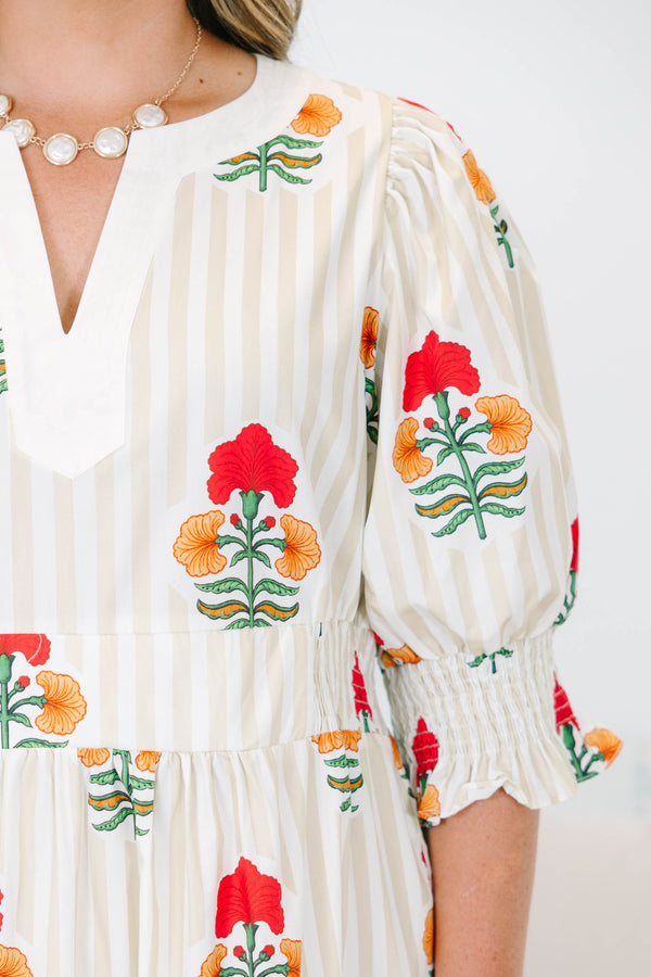Plus Size cream tiered maxi dress with vertical stripes, red floral print, and smocked puff sleeves.