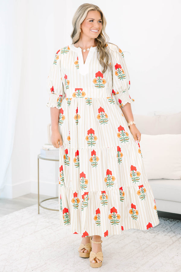 Plus Size cream tiered maxi dress with vertical stripes, red floral print, and smocked puff sleeves.