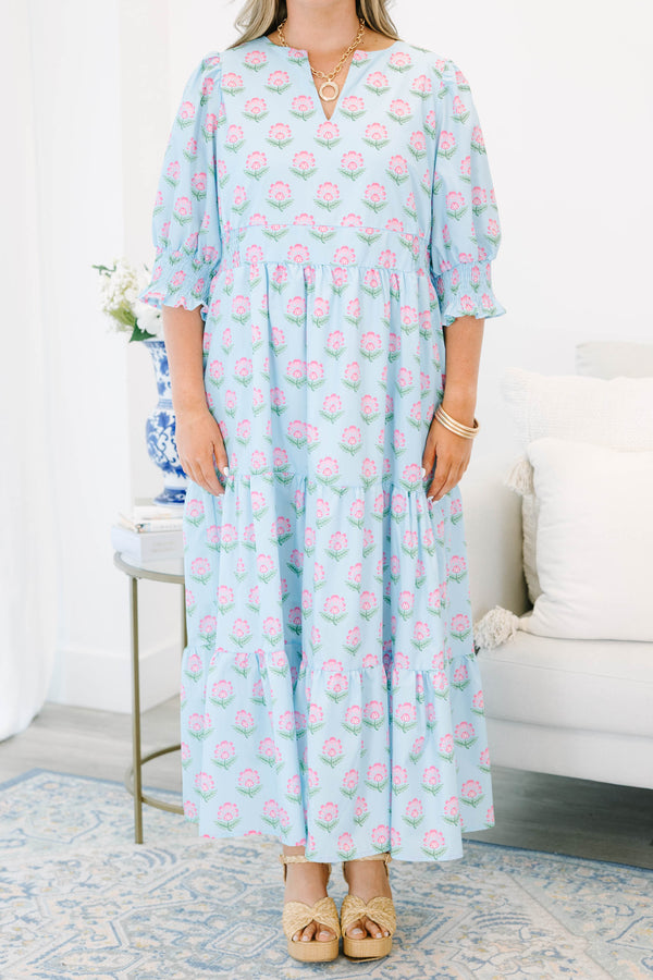 Plus size baby blue tiered maxi dress with pink floral print, ruffle sleeves, and a flowy fit.