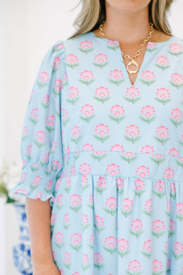 Plus size baby blue tiered maxi dress with pink floral print, ruffle sleeves, and a flowy fit.