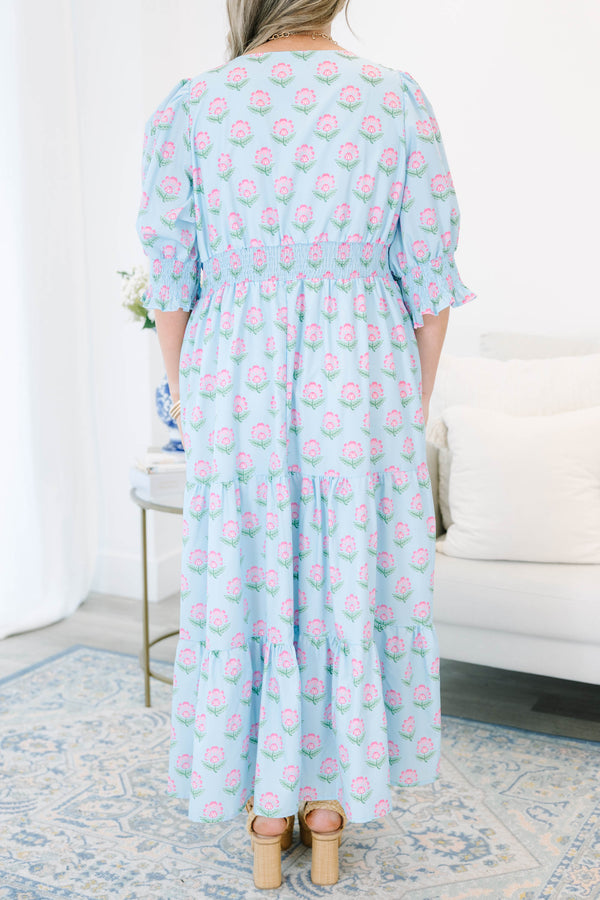 Plus size baby blue tiered maxi dress with pink floral print, ruffle sleeves, and a flowy fit.