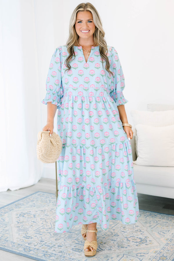 Plus size baby blue tiered maxi dress with pink floral print, ruffle sleeves, and a flowy fit.