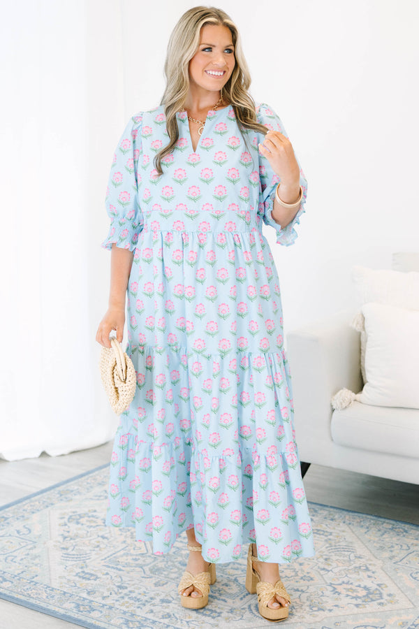 Plus size baby blue tiered maxi dress with pink floral print, ruffle sleeves, and a flowy fit.